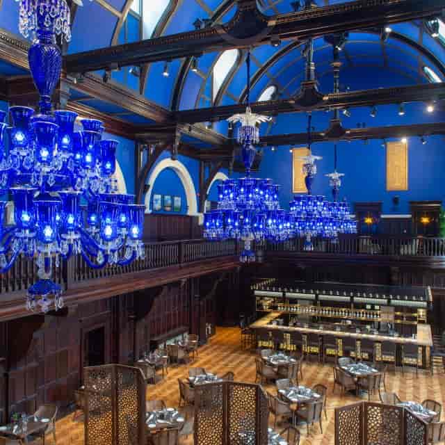Tea Lounge at The LaLiT London with elegant blue chandeliers, perfect for upscale events.