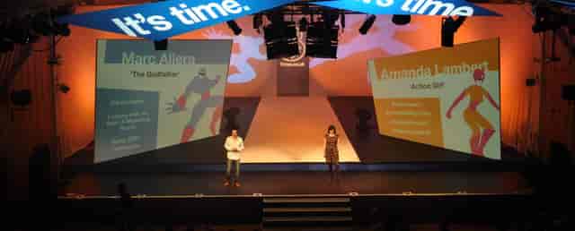 The Great Hall at Imperial College with vibrant corporate event stage setup.