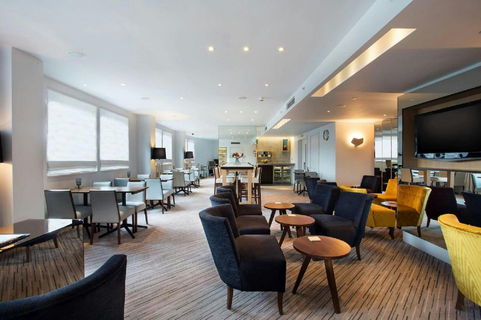 Executive Lounge at Hilton London Tower Bridge, modern seating for networking events.