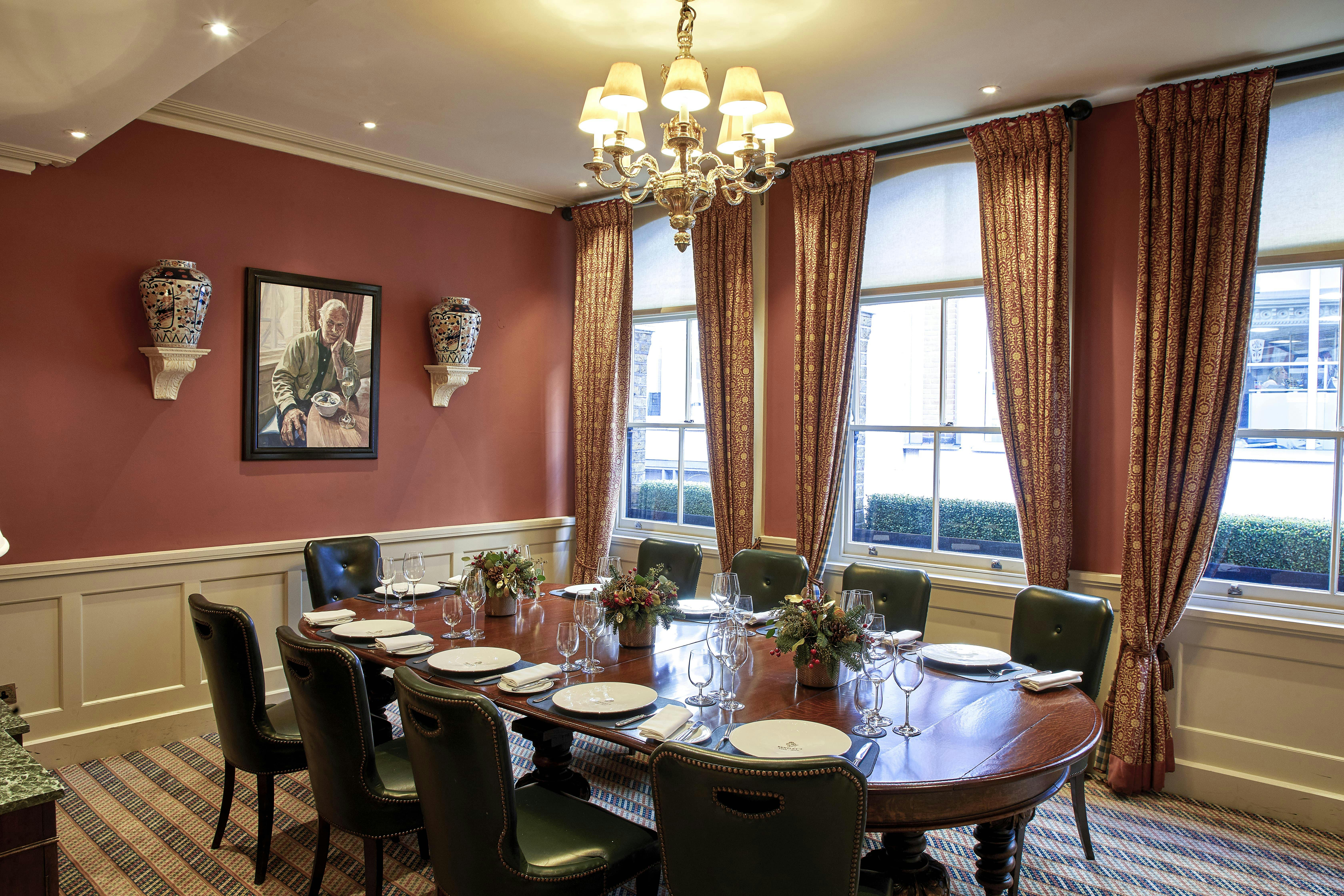 Elegant meeting room with round table, perfect for private events at Bentley's Oyster Bar.