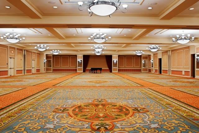 Elegant ballroom with chandeliers at DoubleTree Austin for conferences and receptions.