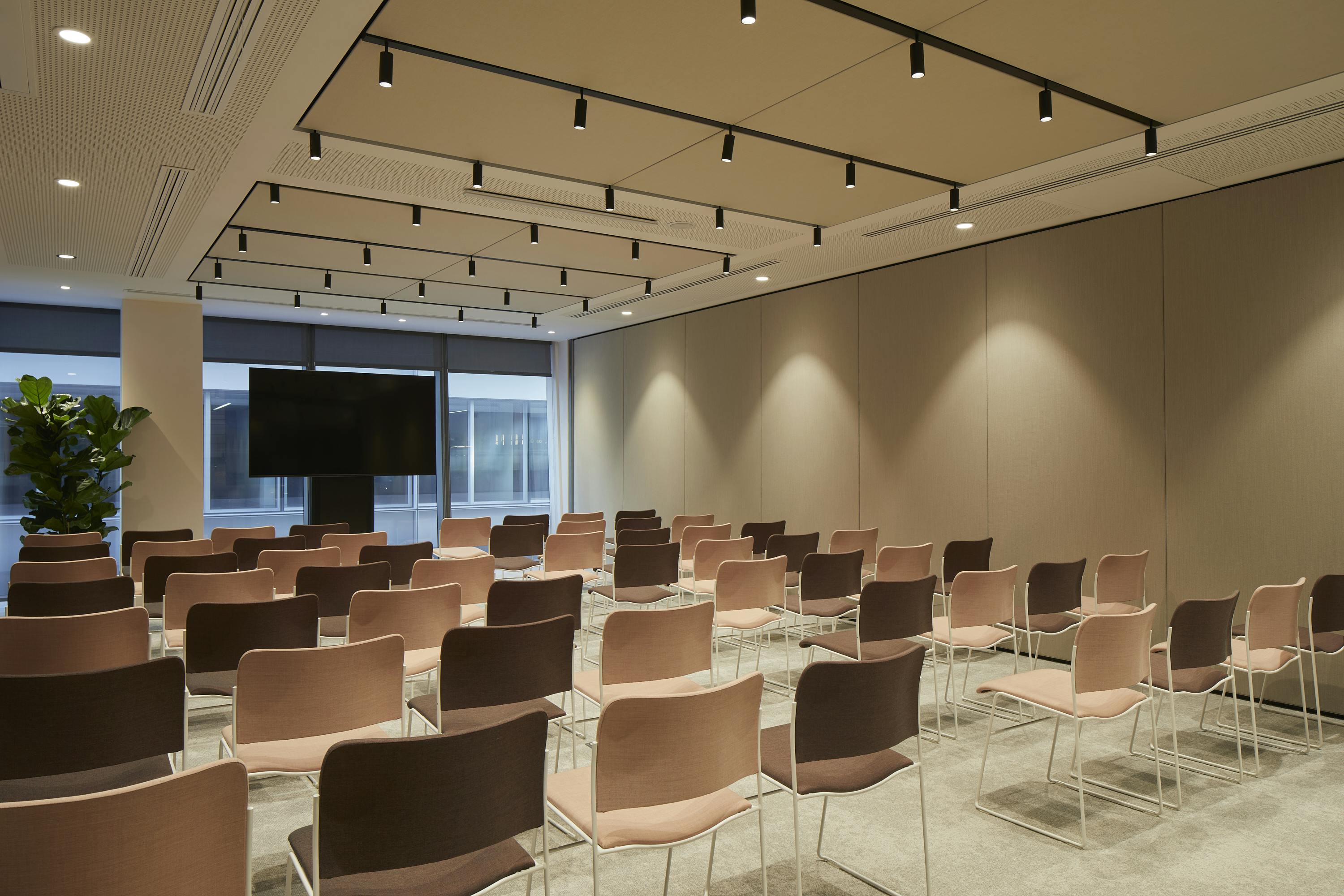 Modern meeting space with sleek chairs, ideal for workshops and corporate events.