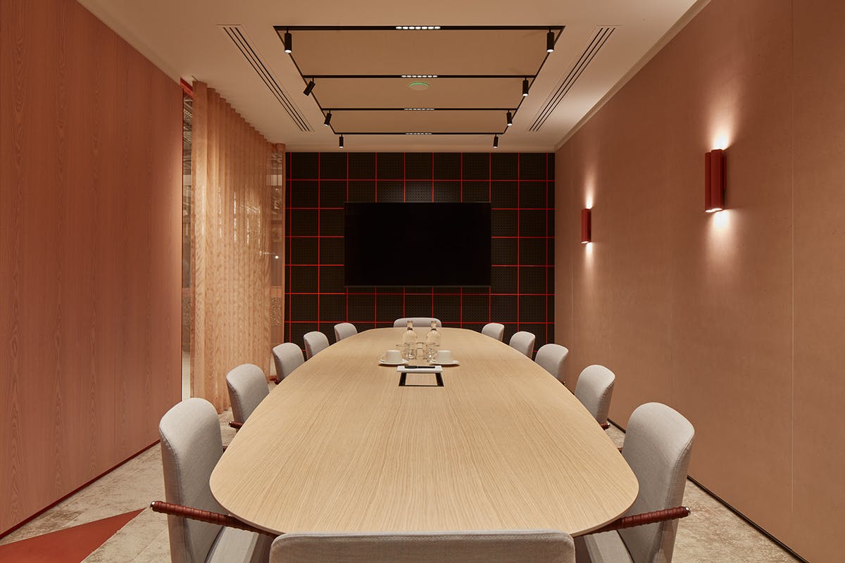 Modern conference room with elongated table, ideal for corporate events and team workshops.