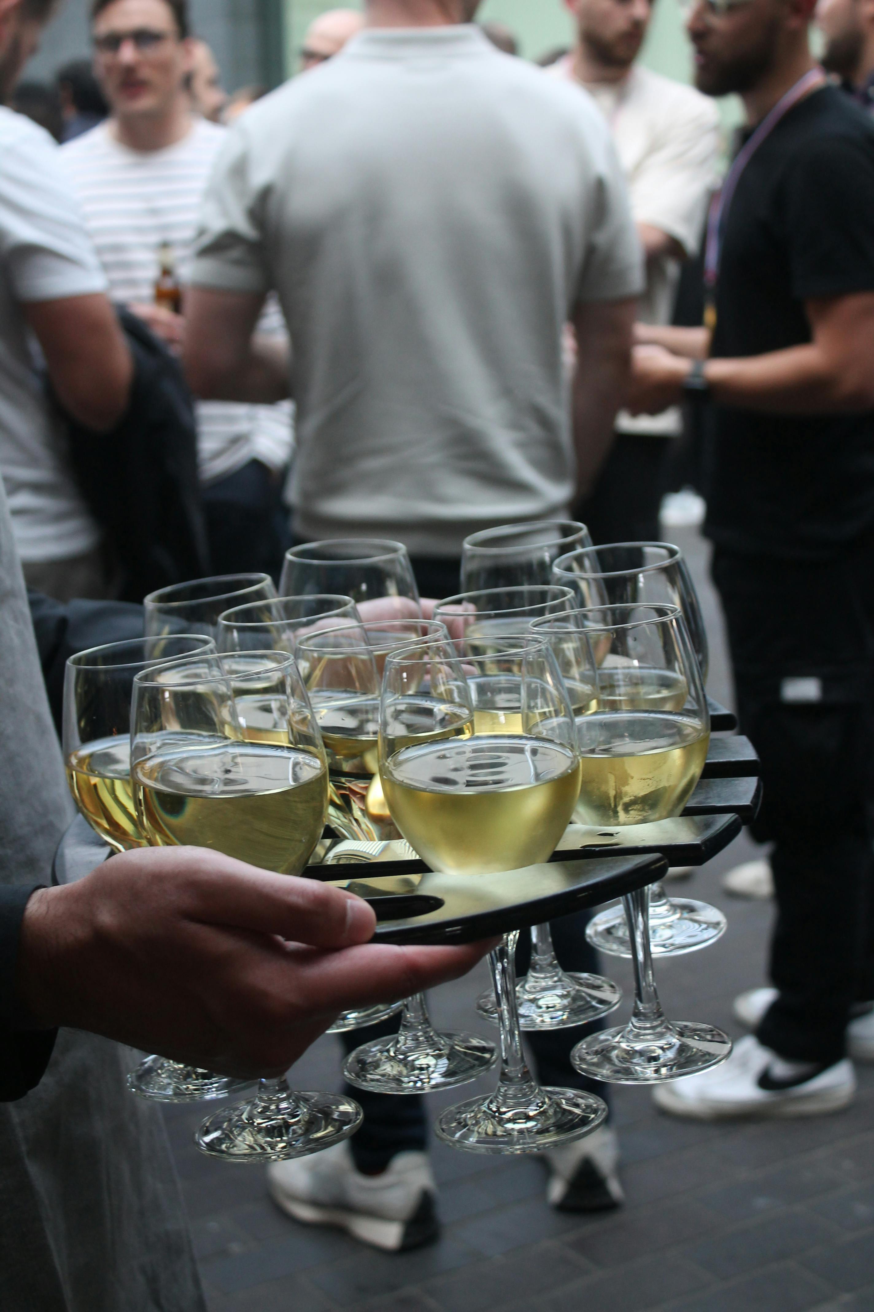 Vibrant networking event in London Museum Spaces with attendees enjoying refreshments.