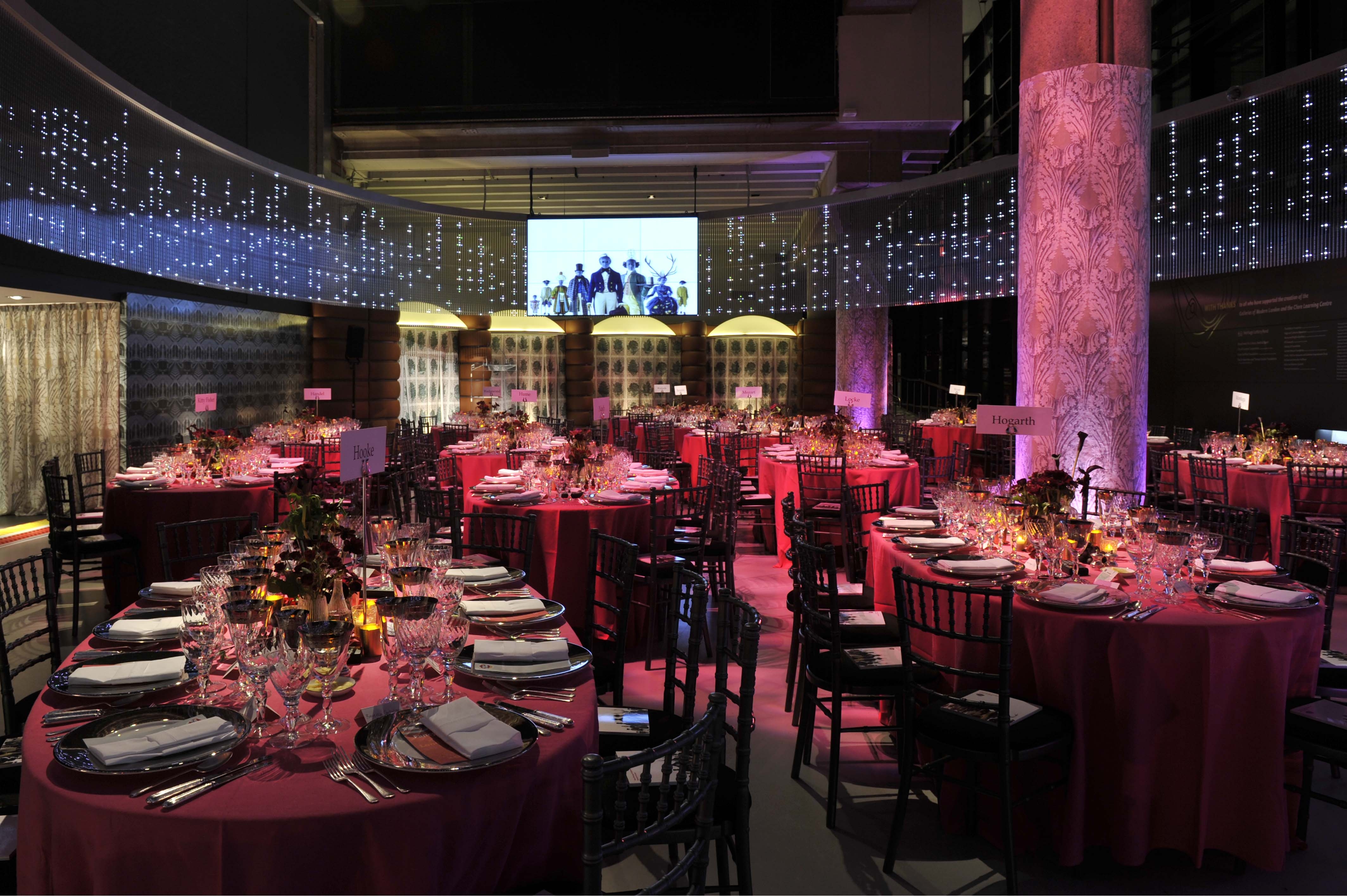 Elegant London Ellipse Hall set for a gala dinner with fine tableware and soft lighting. - Banner