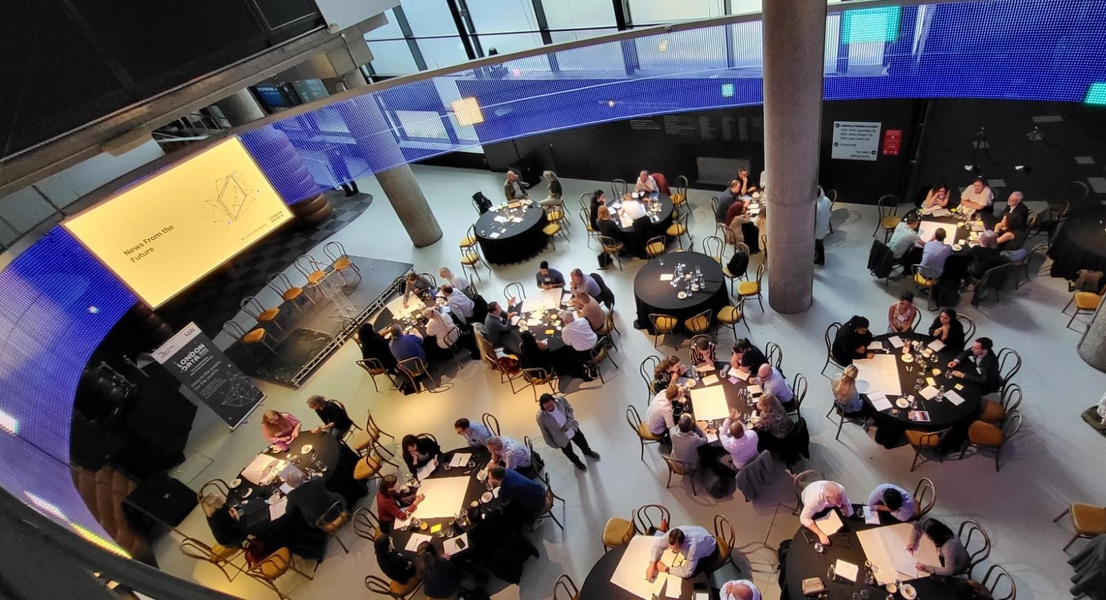 London Ellipse Hall event space with round tables for meetings and workshops.