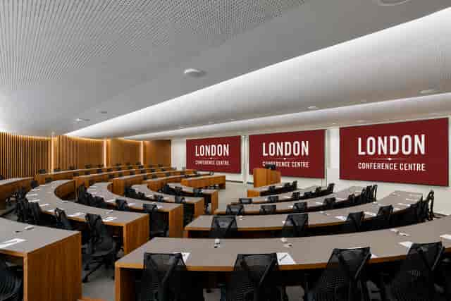 Tiered MBA classroom with fixed seating for corporate presentations and educational seminars.