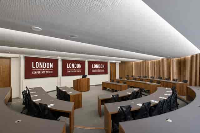 Tiered boardroom setup in London conference centre for business meetings and corporate seminars.