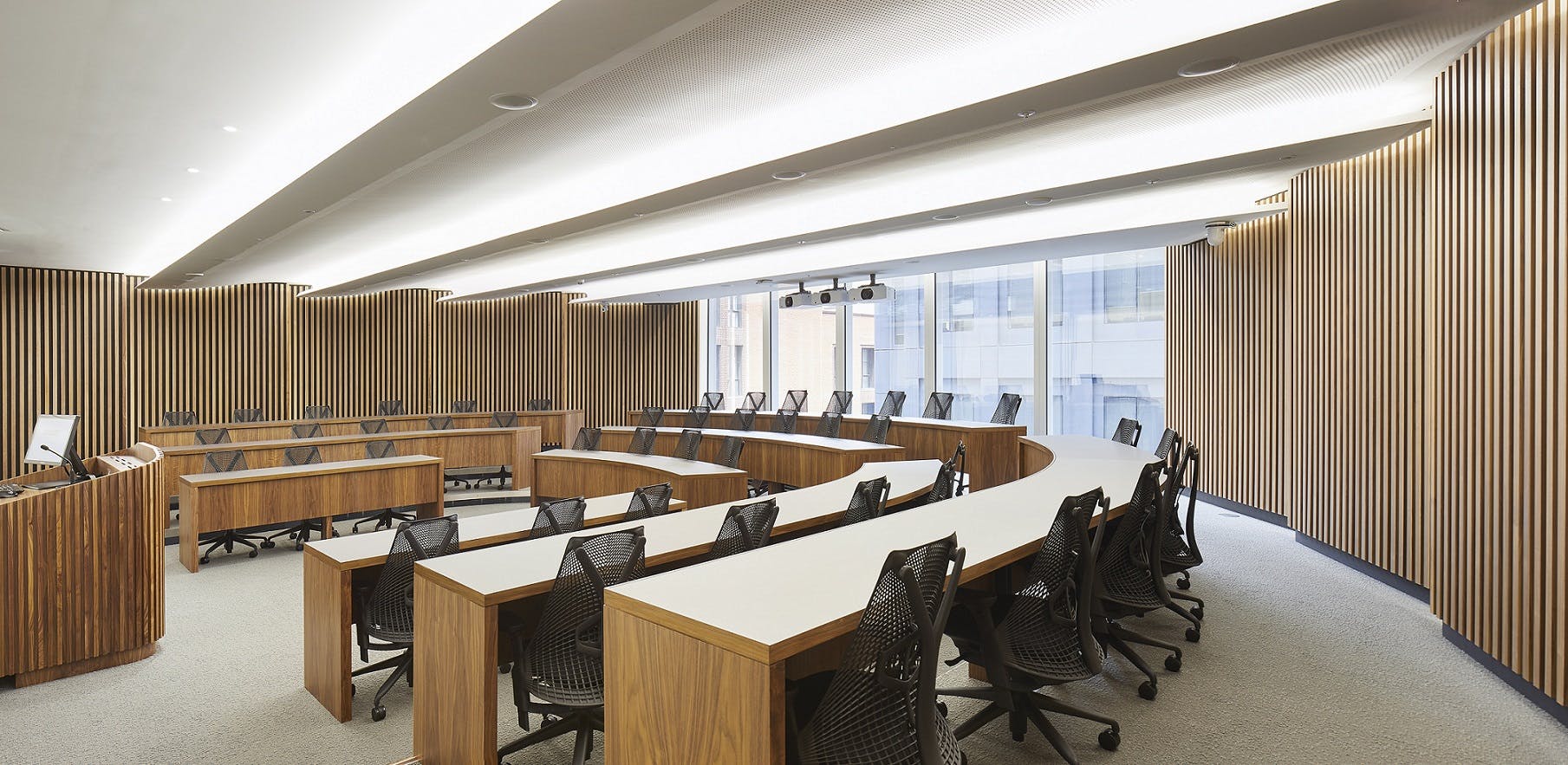 Modern Executive Education Classroom with curved seating for workshops in London.