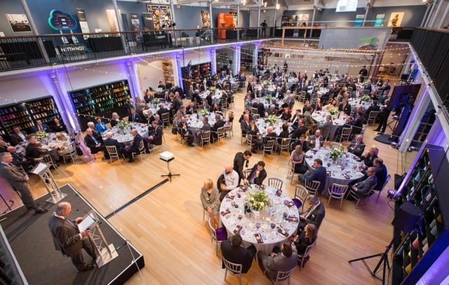 Weaving Floor at Dovecot Studios, elegant tables set for a corporate event.