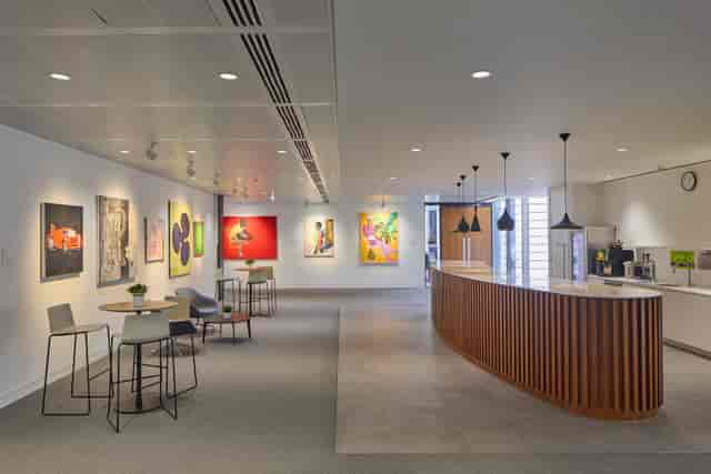 Modern London conference centre lounge with curved bar for corporate networking and breakout events.