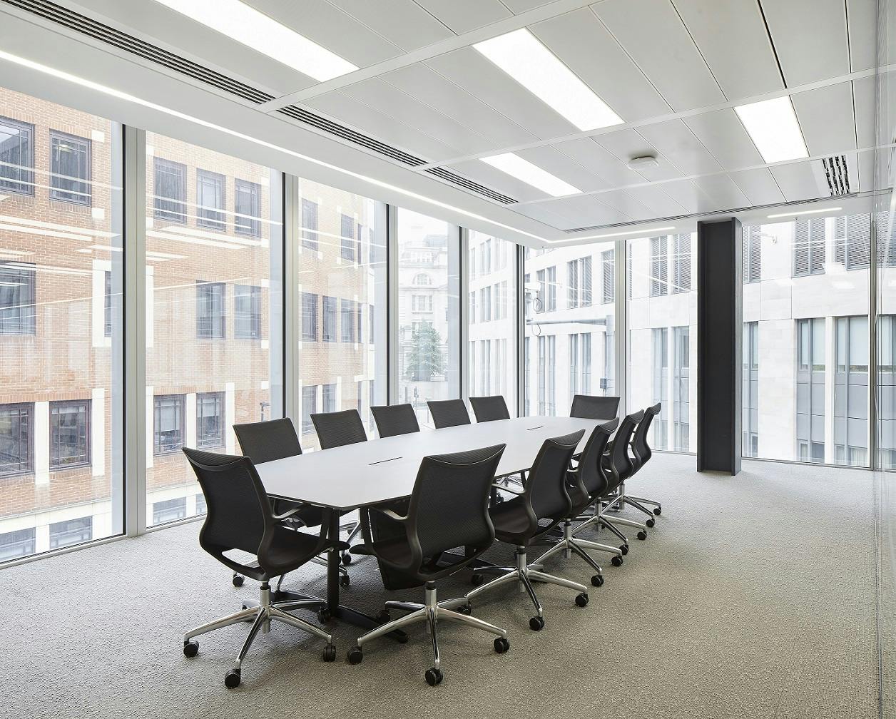 Modern conference room with large table and ergonomic chairs, ideal for meetings in London.