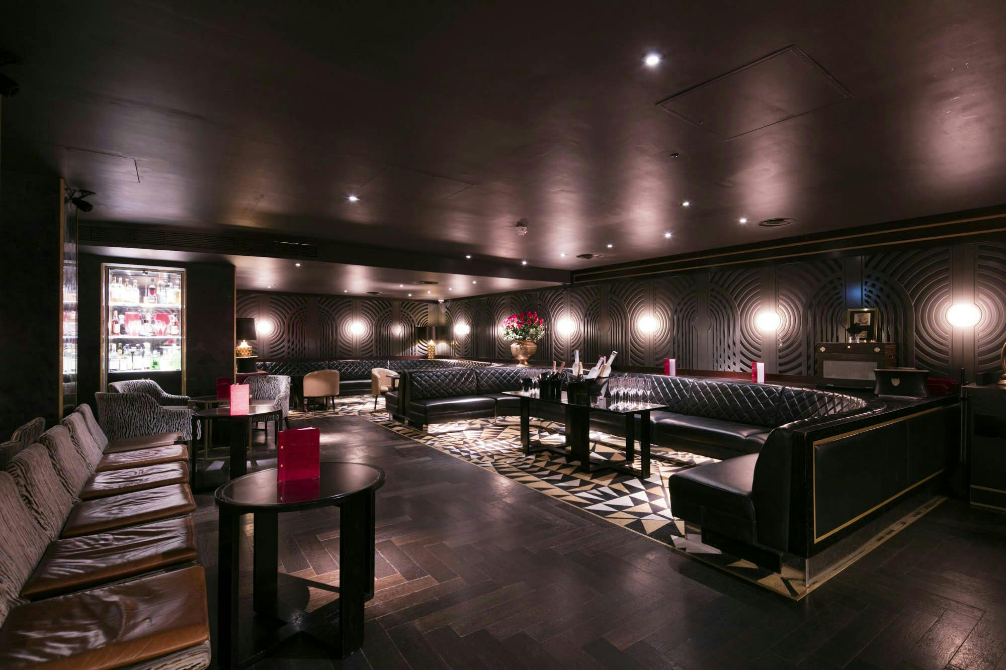 Sophisticated lounge with plush seating at Capeesh Cucina for networking events.