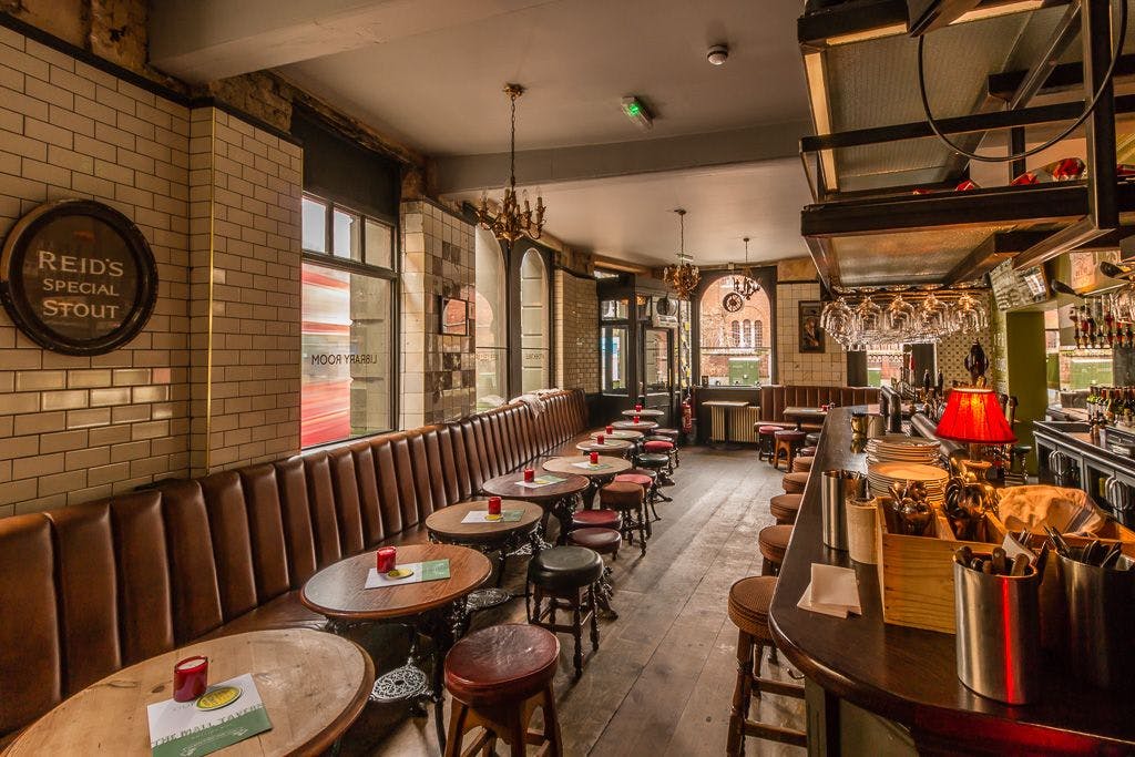 Stylish pub room with cozy seating for informal meetings and events in Notting Hill.