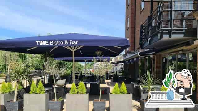 Outdoor terrace at Aqua Vista Bistro Bar with modern planters, ideal for networking events.