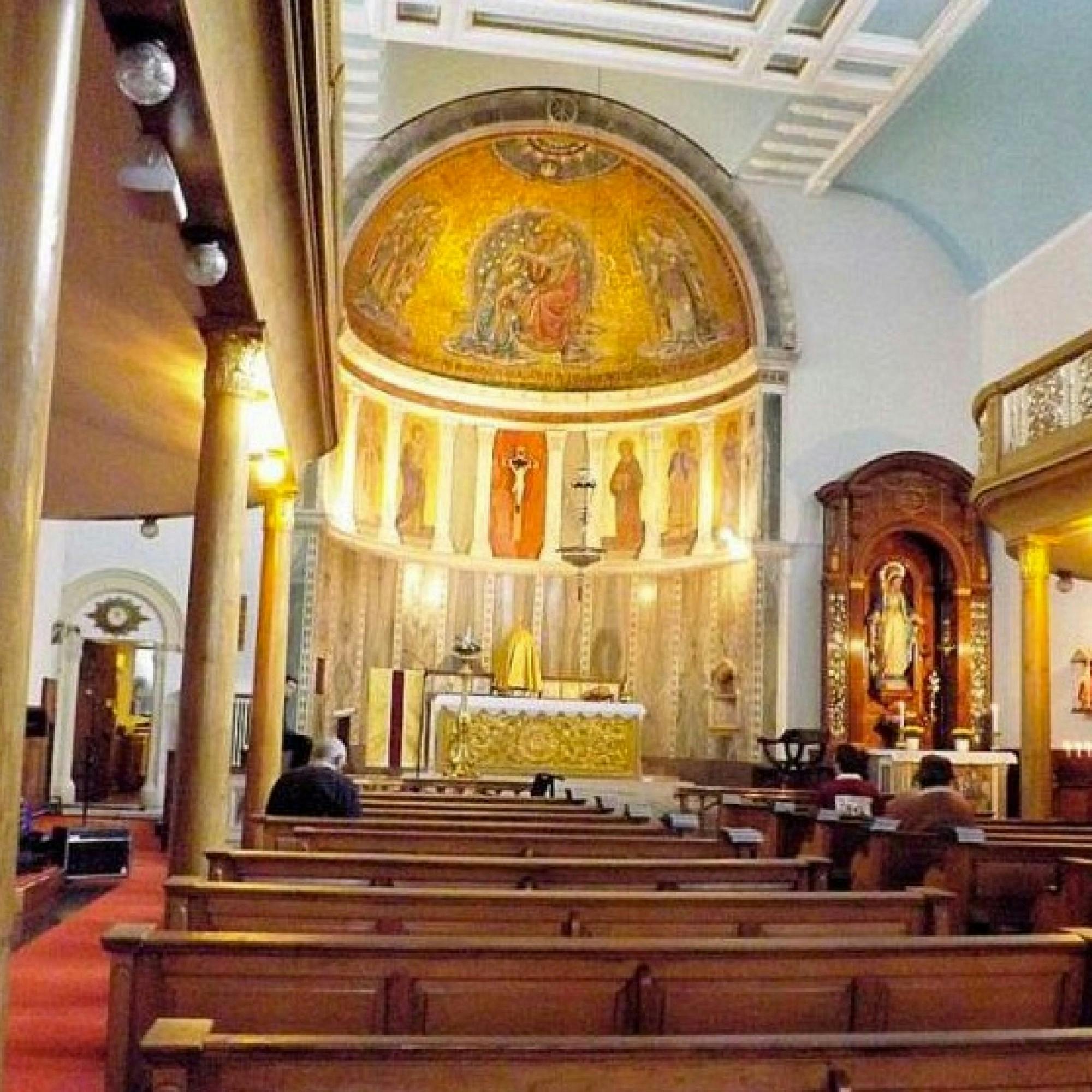 Ornate altar in Our Lady of the Assumption Church Hall for events and ceremonies.