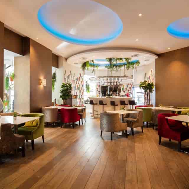 Vibrant event space with colorful seating for intimate gatherings and networking.