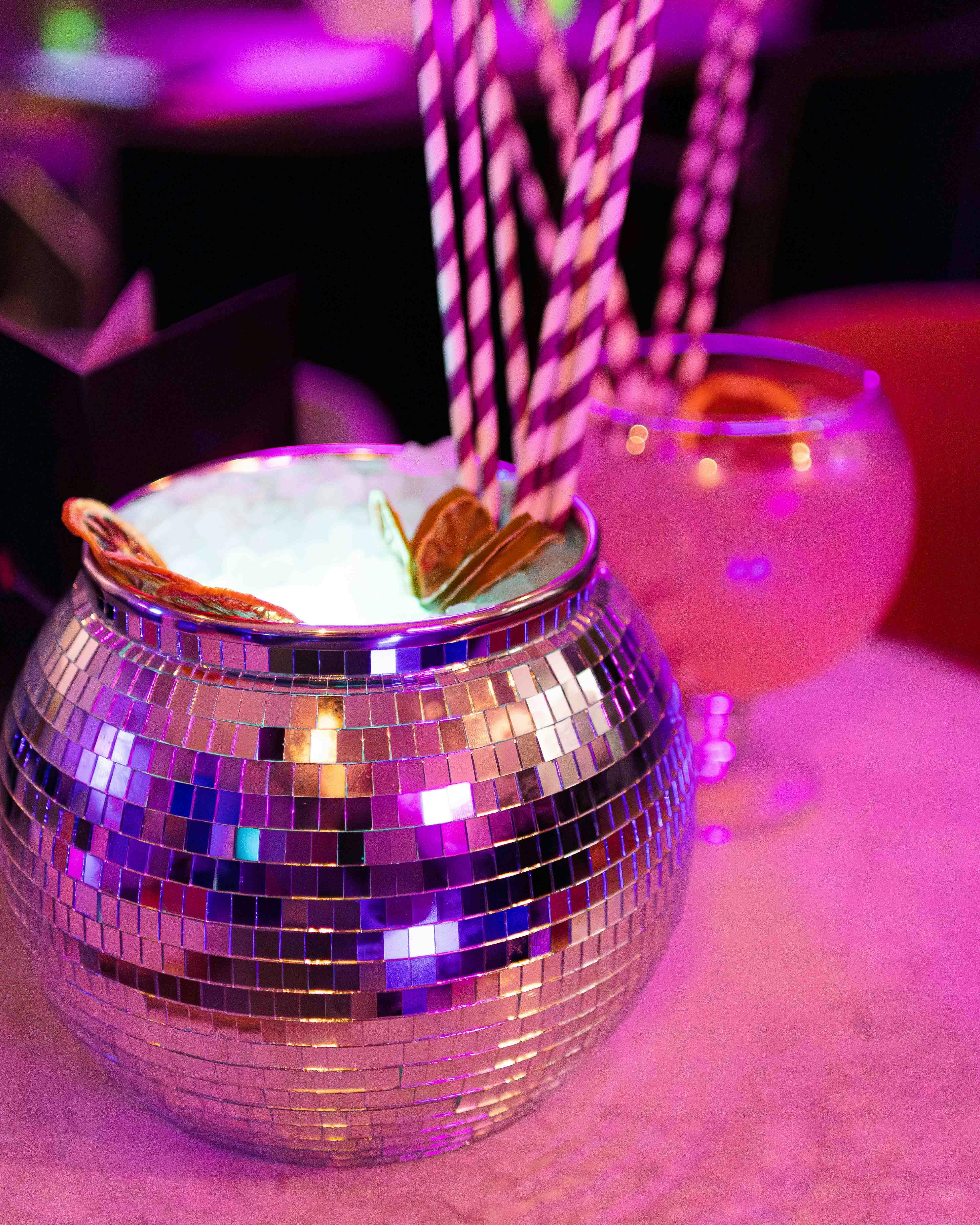 Vibrant disco ball cocktail at Bath Karaoke, perfect for themed parties and events.