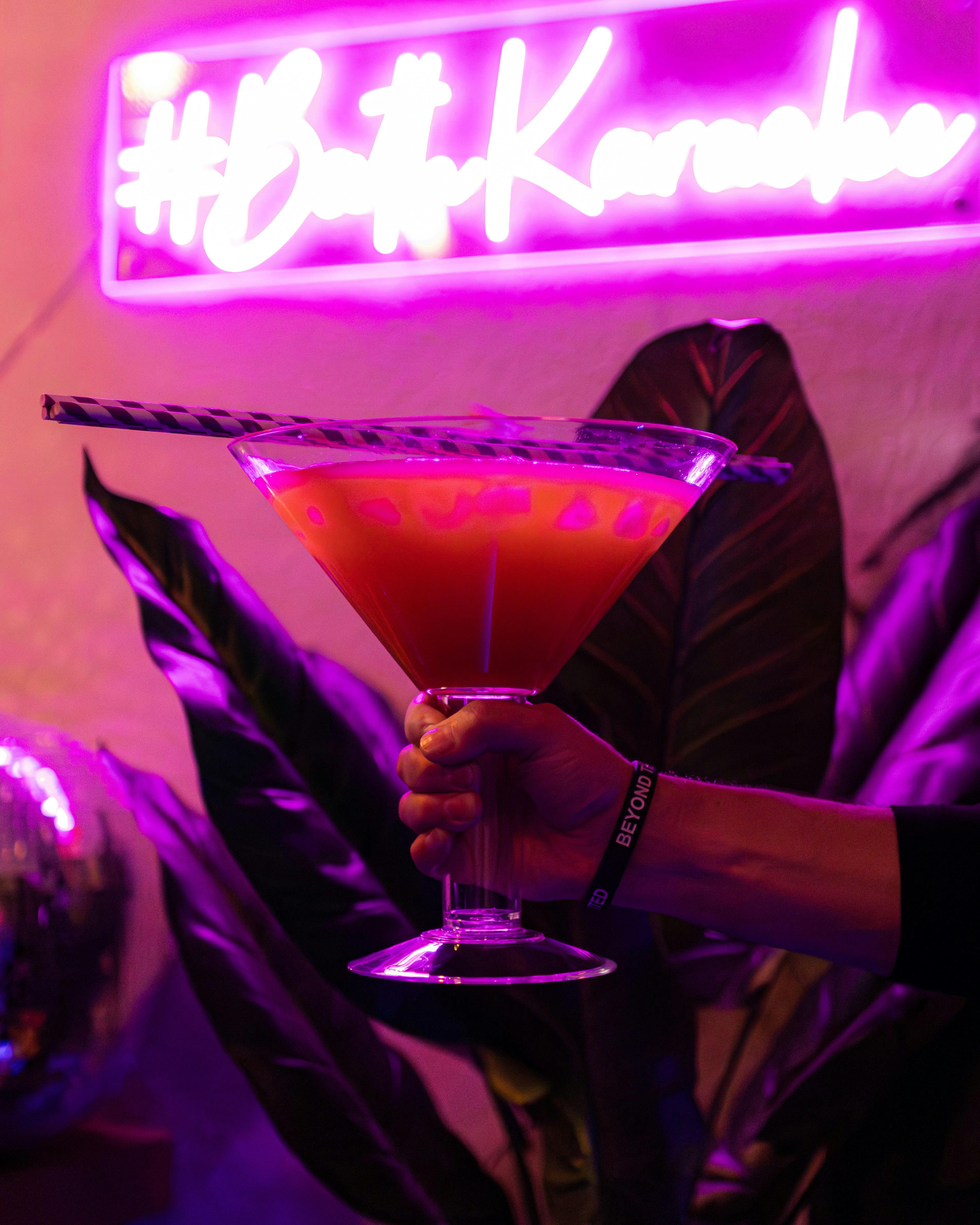 Vibrant cocktail in martini glass at Bath Karaoke, perfect for social gatherings.