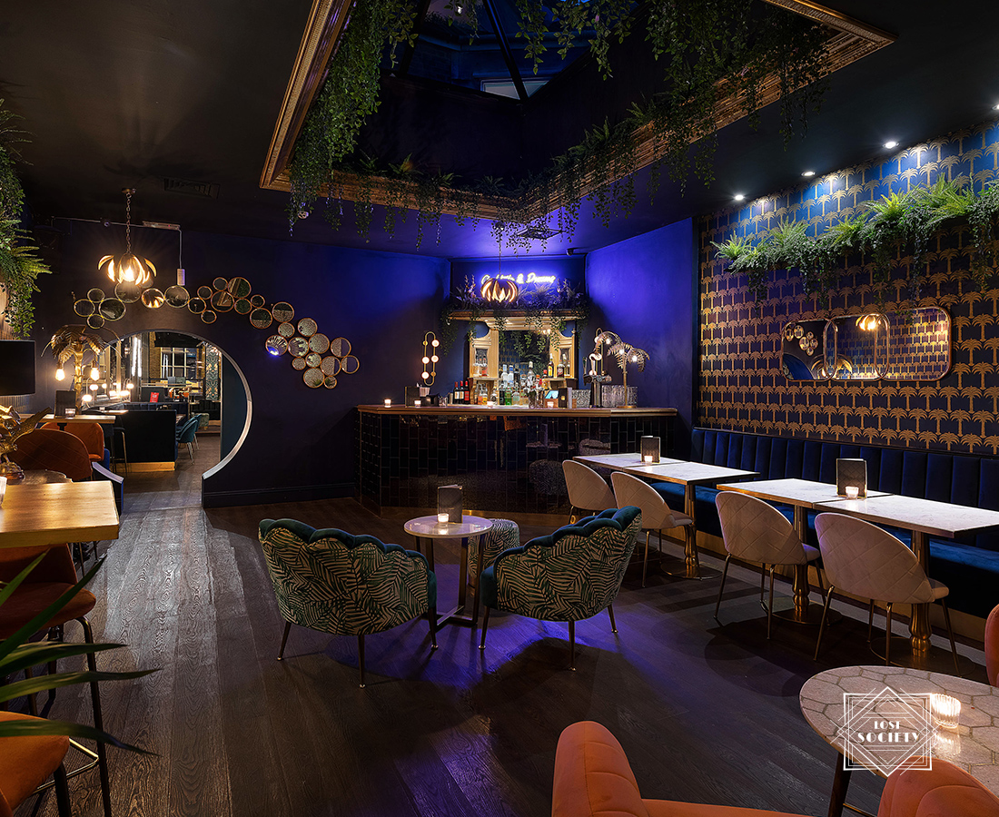 Stylish Lounge Bar in Lost Society, ideal for networking events with vibrant decor. - Banner