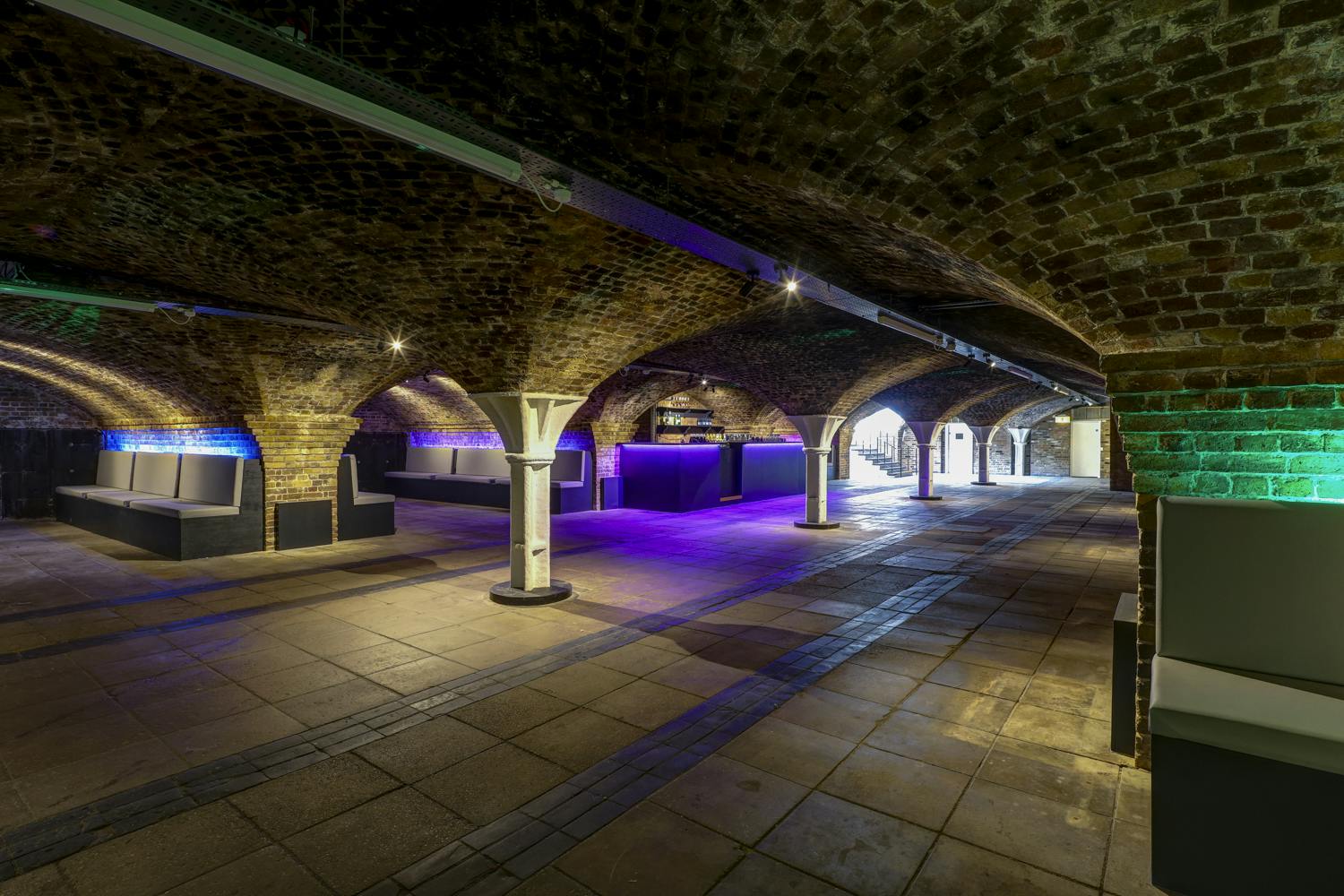 Princess Diana Exhibition in Dockside Vaults with arched brick ceilings, ideal for events.