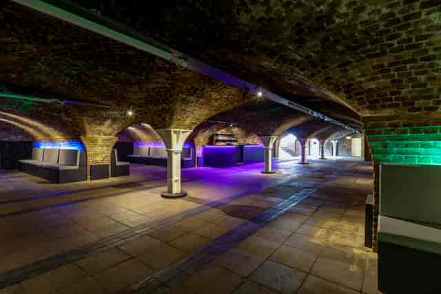 Princess Diana Exhibition in Dockside Vaults with arched brick ceilings, ideal for events.