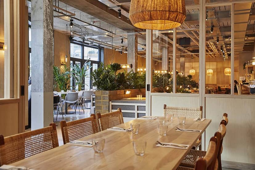 Modern dining space in Caravan Canary Wharf, ideal for events and meetings.