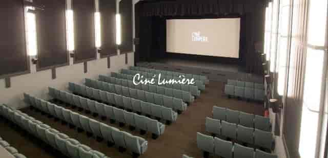 Ciné Lumière cinema with tiered seating, perfect for film screenings and events.
