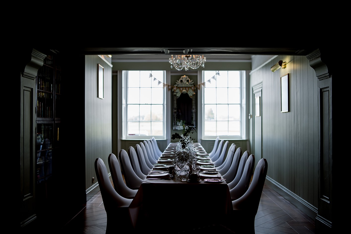 Elegant long dining table setup for corporate dinners at The Clarendon Hotel. - Banner