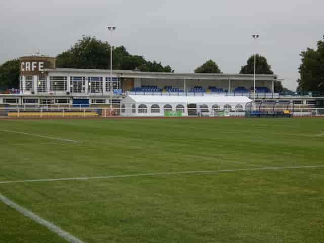 Queen Elizabeth II Stadium with green field, ideal for events and gatherings in Enfield.
