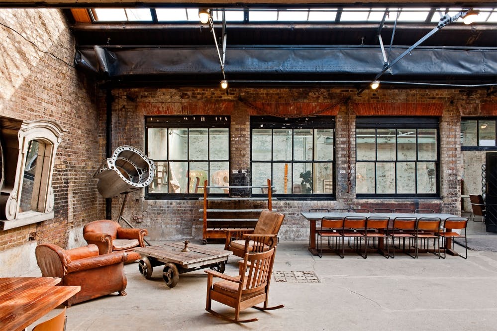 Versatile industrial-chic event space with exposed brick for workshops and meetings.