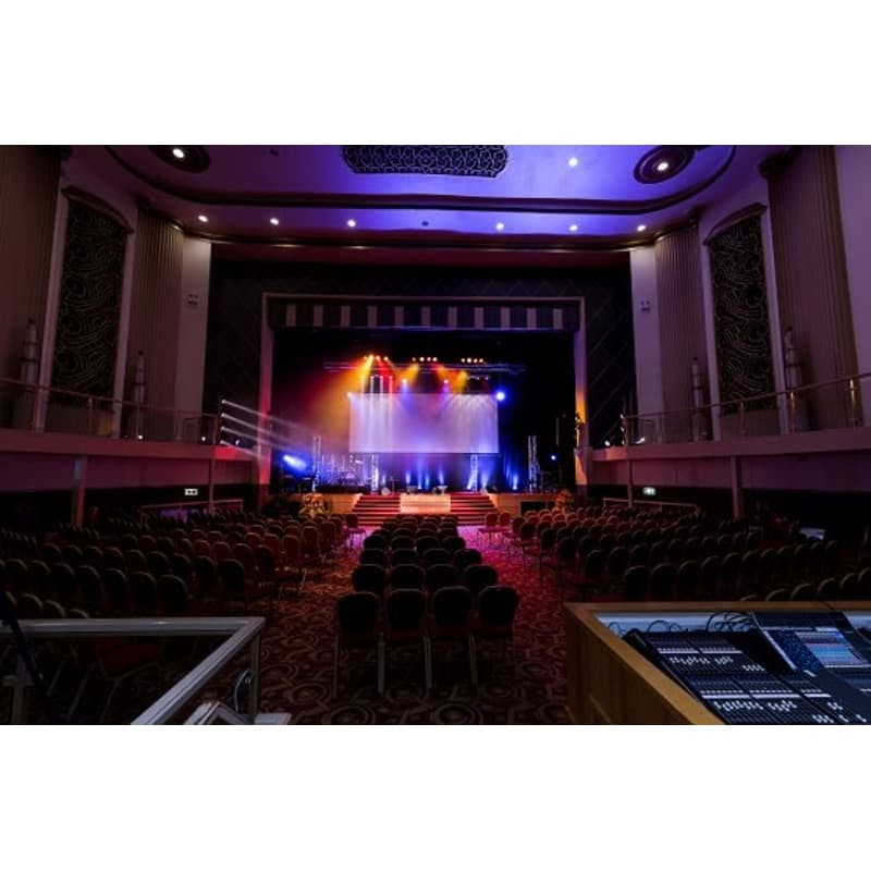 Event space in The Lighthouse Theatre with vibrant stage lighting for conferences and performances.