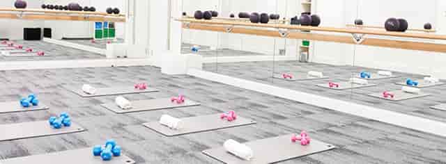 Fitness studio in Barrecore Wimbledon with exercise mats, ideal for wellness events.