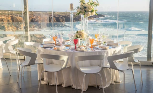 Elegant dining table with ocean view at Oceano Room, ideal for upscale events.