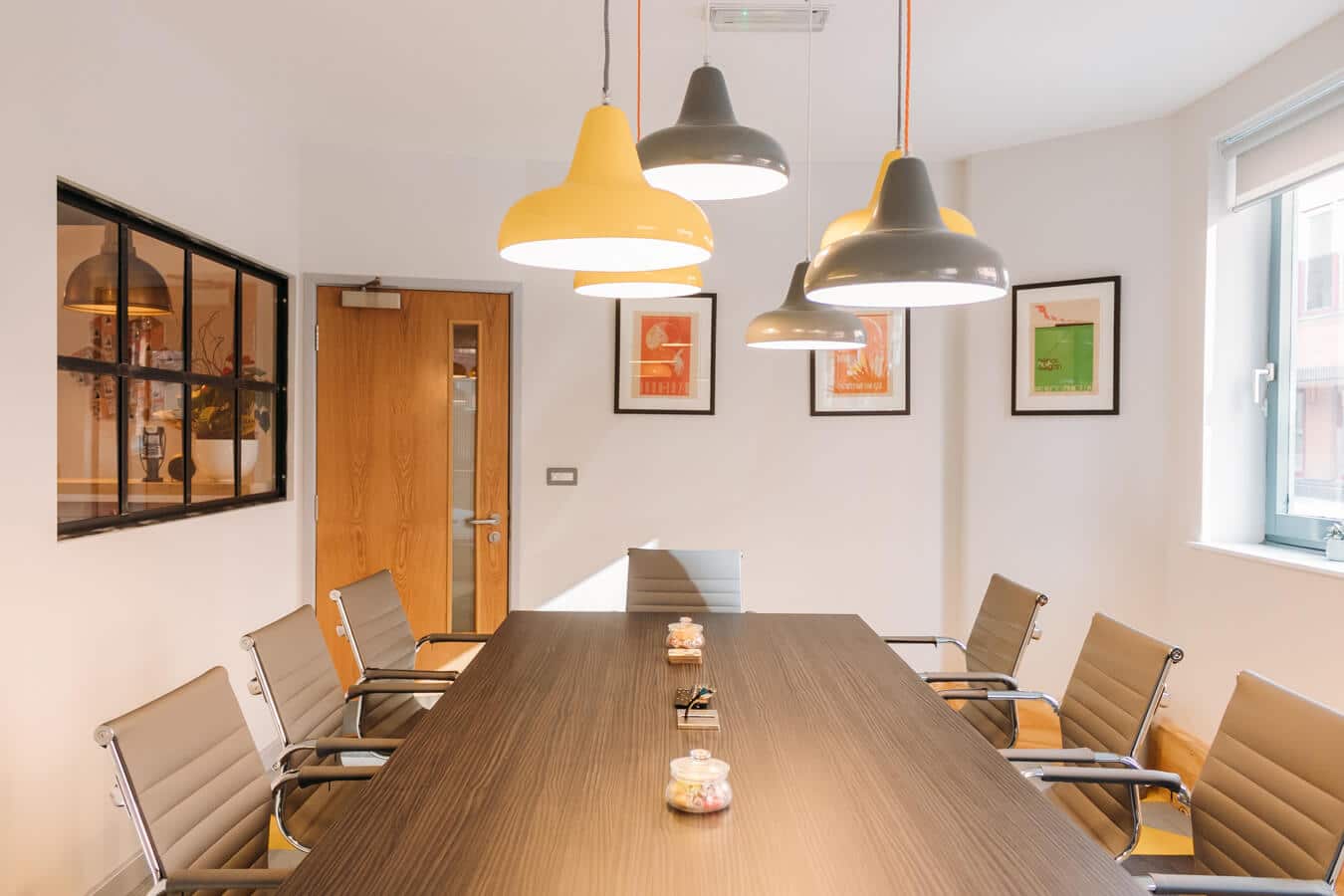 Modern conference room with ergonomic chairs for productive meetings at Wizu Workspace. - Banner