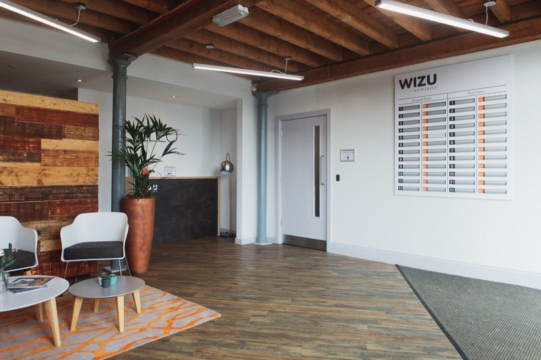 Modern reception area at Beck Mill, featuring warm wood accents for events and meetings.