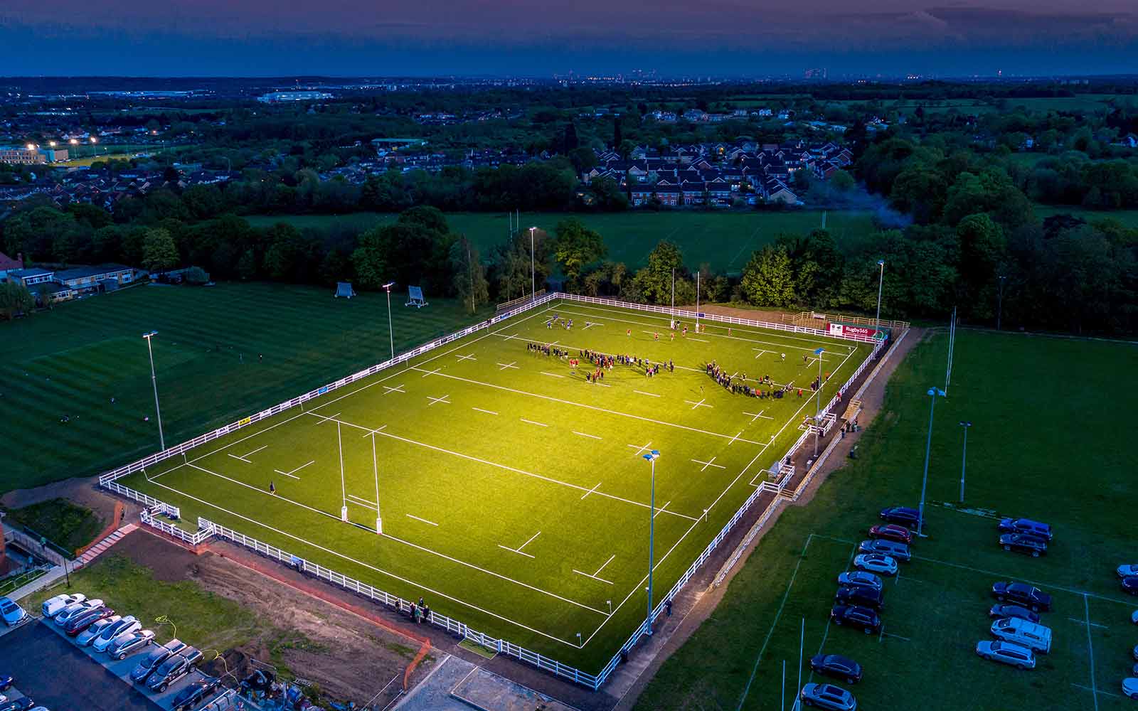 Illuminated rugby field at Rosedale Sports Club, ideal for outdoor events and gatherings. - Banner