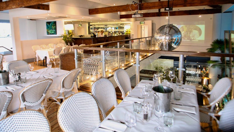 Glass-walled riverside dining room with elegant decor for events and meetings at The Wharf Teddington.