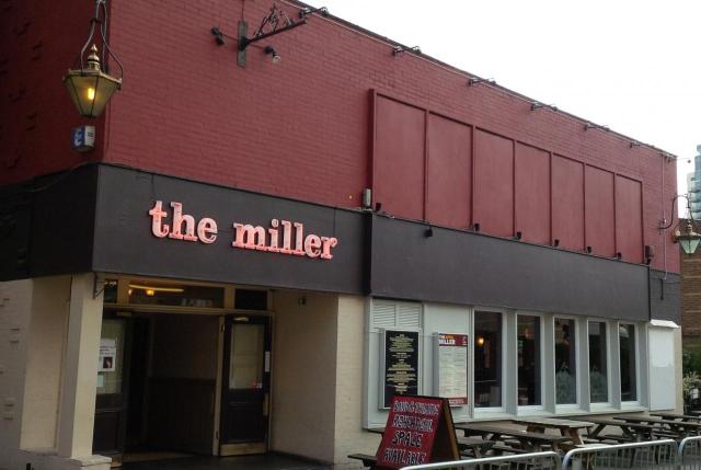 Welcoming pub exterior with outdoor seating, ideal for casual meetings and events. - Banner