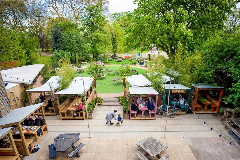 Vibrant beer garden at The Victoria with cozy seating for casual events and gatherings. - Banner
