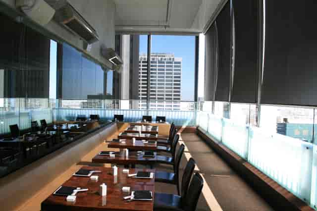 Rooftop dining at Takami Sushi with city views, ideal for corporate events and gatherings.