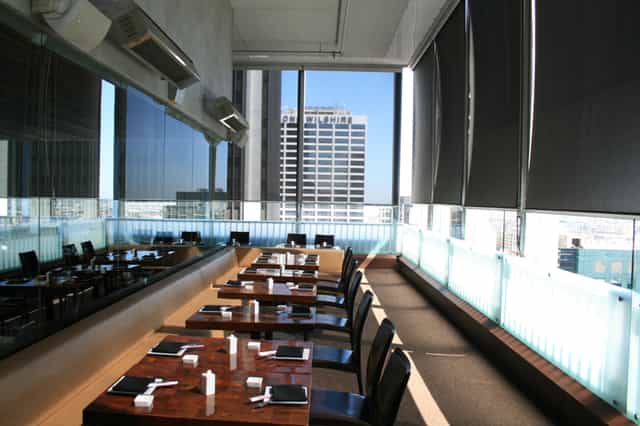 Rooftop dining at Takami Sushi with city views, ideal for corporate events and gatherings.