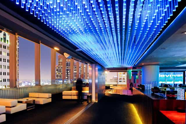 Rooftop event space at Takami Sushi with vibrant ceiling, ideal for upscale gatherings.