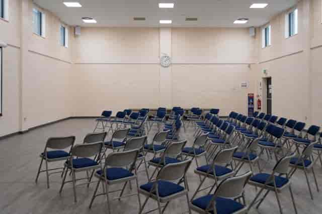 Theater-style Community Hall at The Reach Hub for training seminars and town hall events.