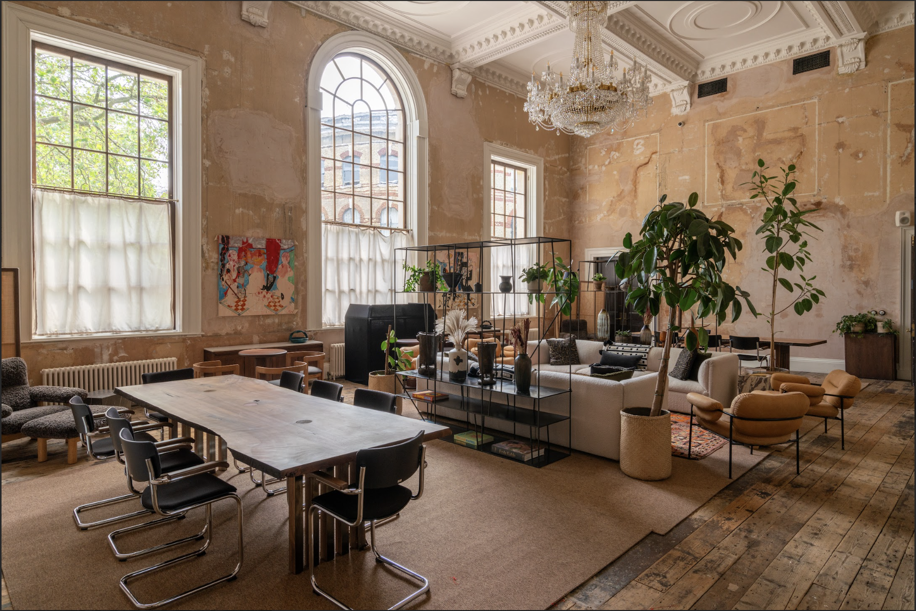 Stylish event venue with high ceilings, ideal for workshops and networking. - Banner