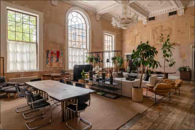 Stylish event venue with high ceilings, ideal for workshops and networking.
