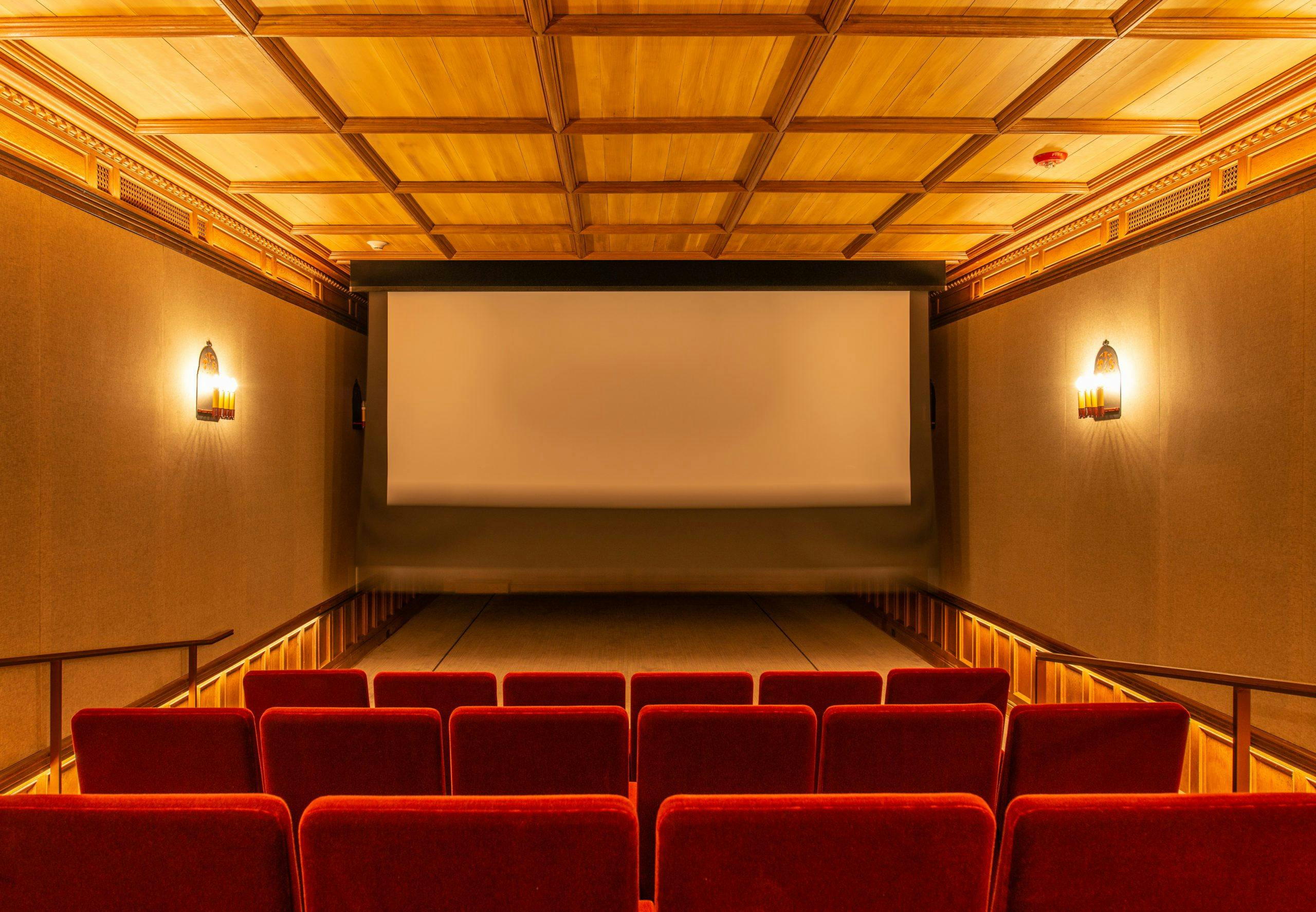 Theatre in Greystone Mansion with plush red seating for intimate film screenings.