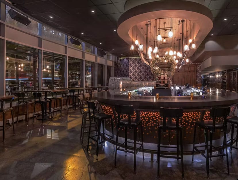 Semi-private oval bar at Siena Tavern, ideal for networking events and cocktail receptions.
