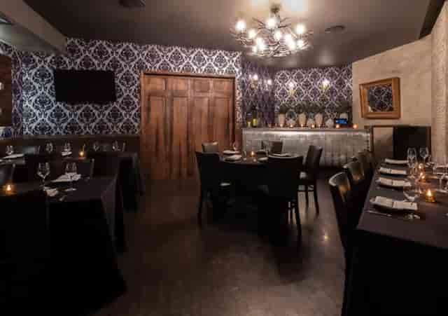 Semi-private oval bar at Siena Tavern, ideal for intimate networking dinners and gatherings.