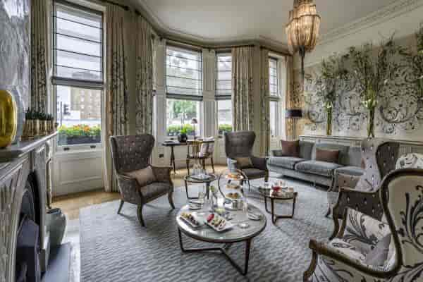 Elegant meeting space in The Adria with plush seating for corporate events.